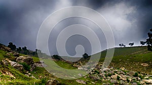 mountains, rocks under dark clouds