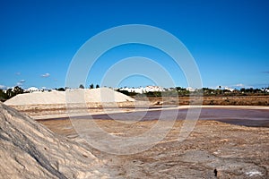 Mountains of salt in Ria Formosa natural park in Aldeia de Marim, Algarve, Portugal