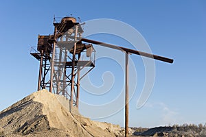 Mountains of sand and gravel in a gravel pit.