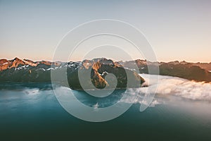 Mountains and sea fjord sunset landscape in Norway