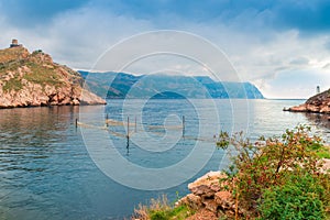Mountains and the sea scenic landscape, dramatic sky above the s