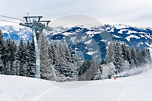 Mountains ski resort Zell am See Kaprun, Austria with snowy forest, cable car and snow in Austrian Alps