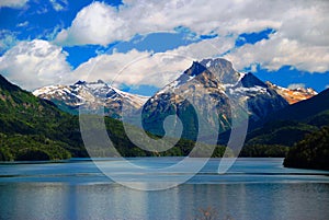 Mountains with snow above blue lake