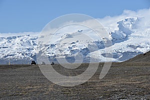 Mountains with snow and vechicles