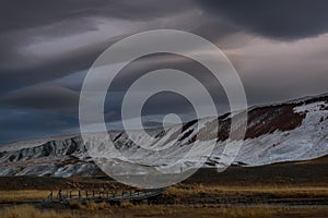 Mountains steppe clouds sky storm sunset