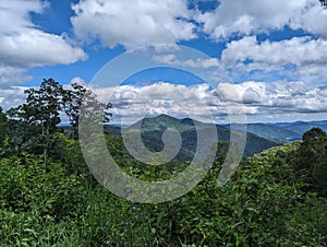 Mountains in the summer with clouds in the sky