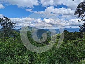 Mountains in the summer with clouds in the sky