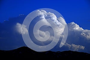 Mountains with Thunderstorm Clouds and Radio Antennae