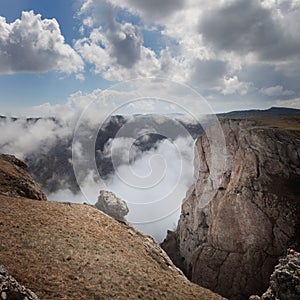 The mountains tower over the clouds