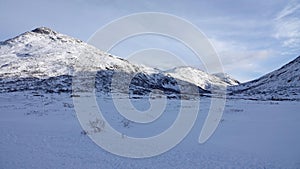 Mountains on Trollstigen road in snow in Norway in autumn