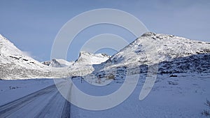 Mountains on Trollstigen road in snow in Norway in autumn