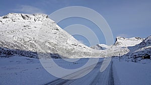 Mountains on Trollstigen road in snow in Norway in autumn