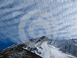 Mountains under feathery clouds