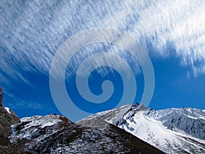 Mountains under feathery clouds