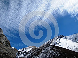 Mountains under feathery clouds