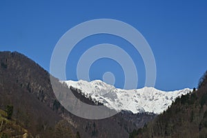 Mountains between winter and spring photo