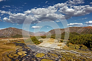 Mountais on the blue cloudy sky. Altay