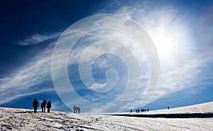 Mountaneers walking on a glacier