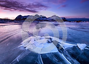 Mountans and frozen ice on at the sunset time. Sea bay and mountains at the sunset timetime.