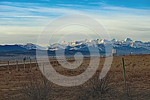 Mountians between blue sky and clouds photo