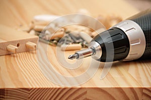 Mounting furniture with screwdriver photo