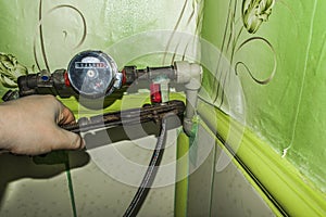 Mounting water meter for plumber. Work with the key.