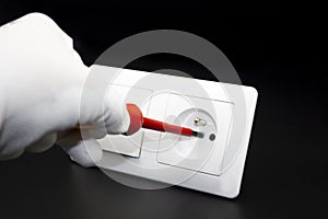 Mounting white electric sockets on black