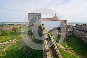 Mourao castle towers and wall historic building with interior garden in Alentejo, Portugal photo