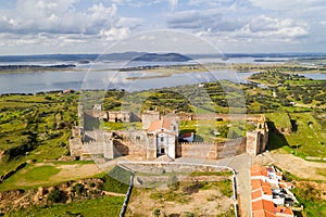 Mourao drone aerial view of castle with alqueva dam lake behind in Alentejo, Portugal photo