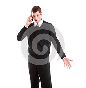 Mournful businessman talking on the phone