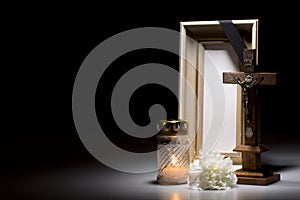 Mourning frame with crucifix, flower and candle