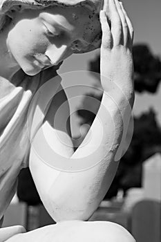 Mourning Statue At A Cemetery