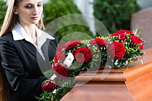 Mourning Woman at Funeral with coffin