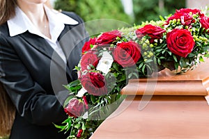 Mourning Woman at Funeral with coffin