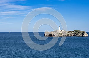 Mouro island lighthouse and boat