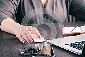 Mouse click, woman hand with mouse and laptop