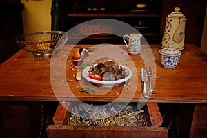 Mouse at he home kitchen. Rat mouse, Rattus norvegicus, eats food rest rubbish from dirty plate dishes, animal bahaviour in