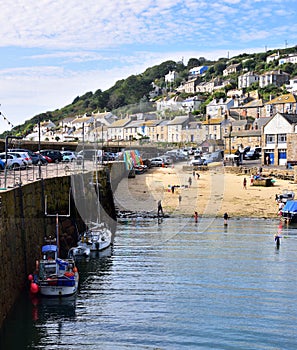 Mousehole`s Tiny Beach and Harbour Wall in Cornwall
