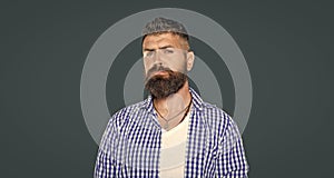 moustached man wear checkered shirt on grey background photo