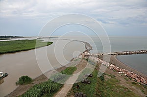 mouth of the Adige river which flows in Italy and flows into the