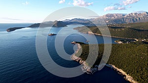 Mouth of the Bay of Kotor with the island of Mamula and green mountain ranges. Drone