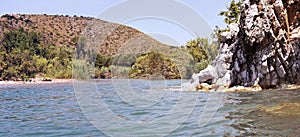 The mouth of the river Lambro near the beach of â€˜Porciâ€™ [Pigs cove]. River and sea.