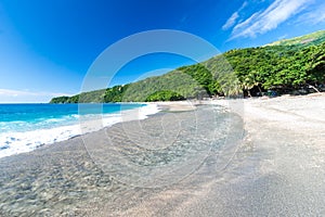 Mouth of the river to the sea on Playa Sana Rafael Beach, Barahona, Dominican Republic