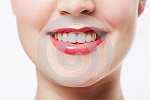 Mouth, teeth and woman with red lipstick, cosmetics or dental for wellness with smile isolated on white background. Lips