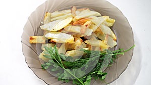 Mouth-watering fried potatoes on a festive glass plate