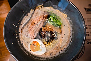 Mouth watering japanese ramen in a bowl served with egg