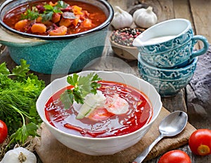 Mouth-watering Ukrainian borsch with sour cream and rye bread