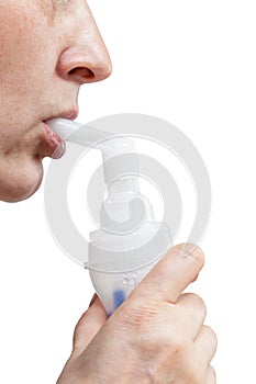 Mouthpiece of jet nebuliser in lips of patient