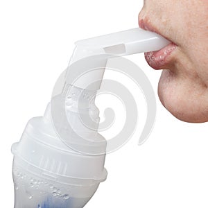 Mouthpiece of jet nebulizer in lips of patient