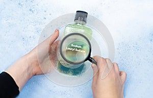 Mouthwash floating in soapy water. Harmful composition of ingredients. Rinse aid with Fluoride. The concept of hazardous